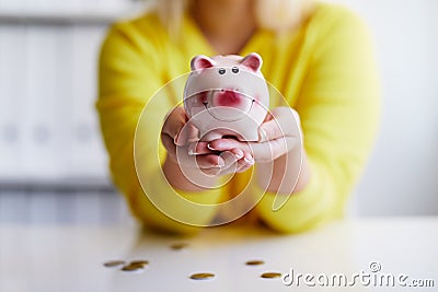 Female hands holds piggy bank Stock Photo