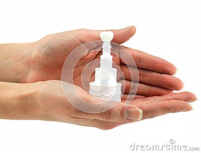 Female hands holds small wedding cake Stock Photo