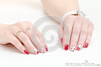 Female hands with manicure, red nail polish, drawing with cherries. White background. Stock Photo