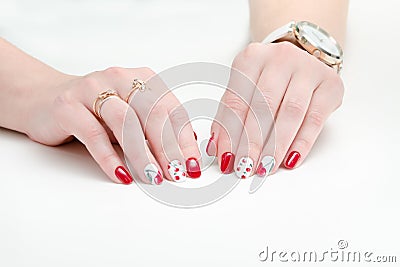 Female hands with manicure, red nail polish, drawing with cherries. White background. Stock Photo