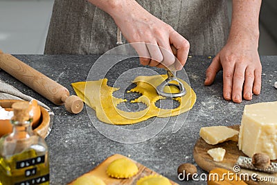 Female hands, process of preparation homemade italian pasta, ravioli Stock Photo