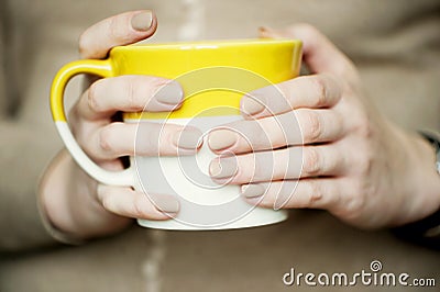 Female hands with soft beige manicure Stock Photo