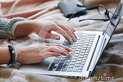 Female hands type on laptop. Job searching online. Stock Photo