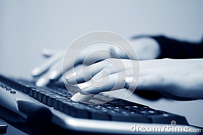 Female hands typing on computer keyboard Stock Photo