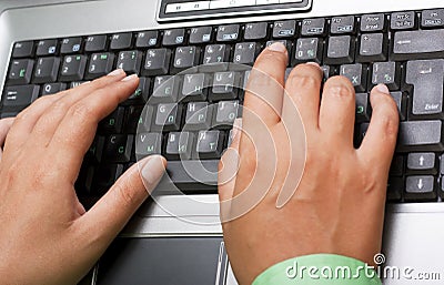 Female hands typing on laptop Stock Photo