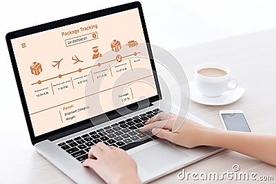 Female hands typing laptop keyboard with package delivery tracki Stock Photo