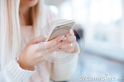 Female hands using smartphone Stock Photo