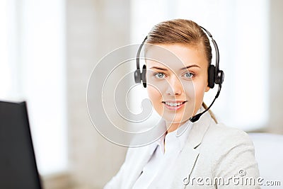 Female helpline operator with headphones Stock Photo
