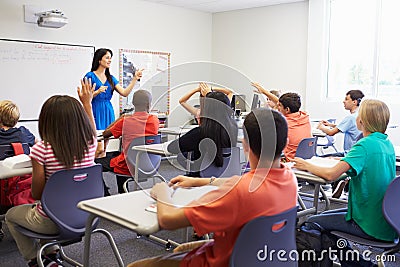 Female High School Teacher Taking Class Stock Photo
