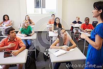 Female High School Teacher Taking Class Stock Photo