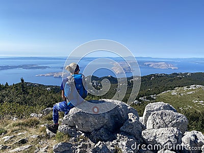 Female hiker on peak in Velebit mountain. Editorial Stock Photo