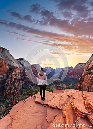 female hiker on rocky mountains Stock Photo