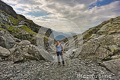 Female hiker in the wilderness of Norway close to Trolltunga rocks Stock Photo