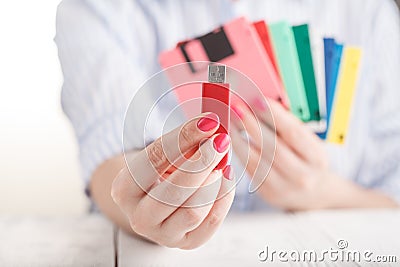 Female hold old floppy disk and modern flash drive Stock Photo