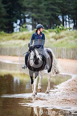 Female horse rider at Holkham National Nature Reserve Editorial Stock Photo