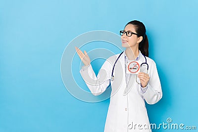 Female hospital doctor making presenting posture Stock Photo