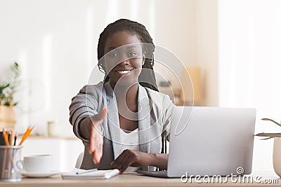 Female HR manager extending hand for handshake after successful job interview Stock Photo