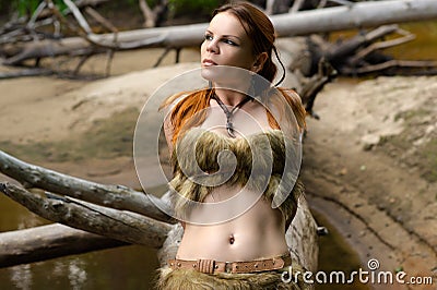 Female hunter lying on a tree Stock Photo