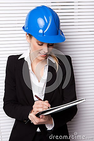 Female Inspector Checking Notes Stock Photo