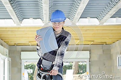 female inspector with clipboard inside property Stock Photo