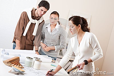 Female interior designer with two clients Stock Photo