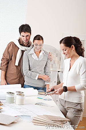 Female interior designer with two clients Stock Photo