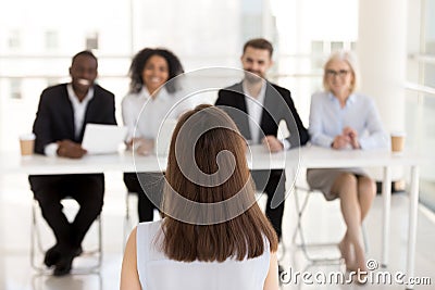 Female job candidate make good first impression on HR managers Stock Photo