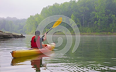 Female kayaker on lake Stock Photo