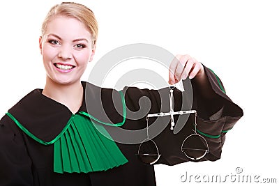Female lawyer attorney in classic polish black green gown and scales Stock Photo