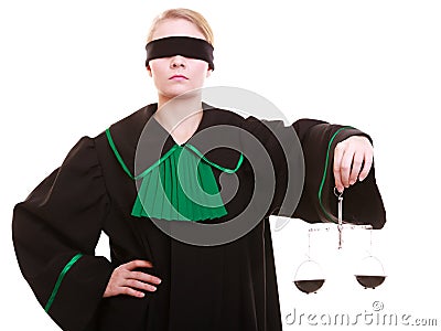 Female lawyer attorney in classic polish black green gown and scales Stock Photo