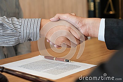 Female lawyer handshake with client. Business partnership meeting successful concept Stock Photo