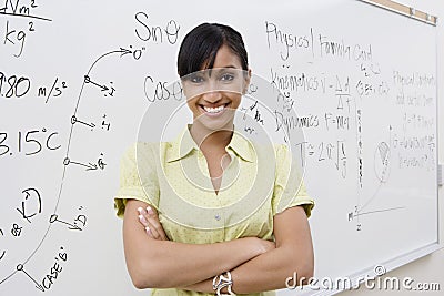 Female Lecturer With Arms Crossed Stock Photo