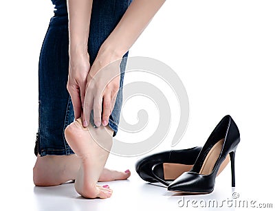 Female legs in jeans black high heels plaster health care beauty pain Stock Photo