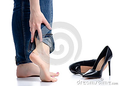 Female legs in jeans black high heels plaster health care beauty pain Stock Photo