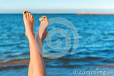 Female legs, sea Stock Photo