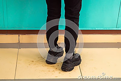 Female legs in sneakers Stock Photo