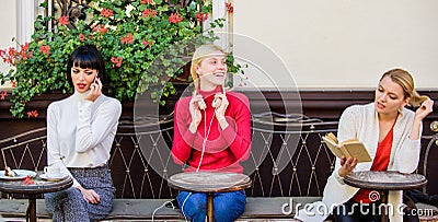 Female leisure. Weekend relax and leisure. Hobby and leisure. Different interests. Group pretty women cafe terrace Stock Photo
