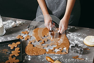 Female making Christmas gingerbread cookies home kitchen Stock Photo