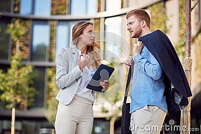 Female and male business cowokers discussing Stock Photo