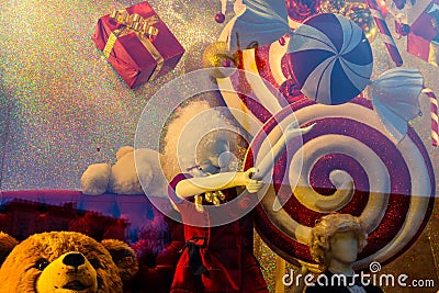 Female mannequin and different christmas decorations in a showcase Stock Photo