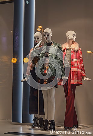 Female mannequins in a shop window on the coat Stock Photo