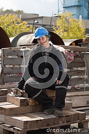 Female manual worker in blue hard hat Stock Photo