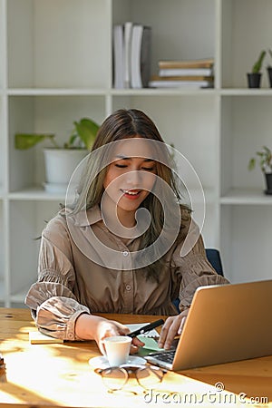Female marketing officer working on her online marketing campaign Stock Photo