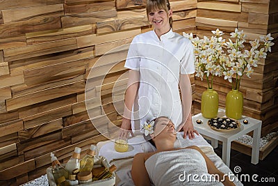 Female masseur give beauty treatment luxury spa Stock Photo