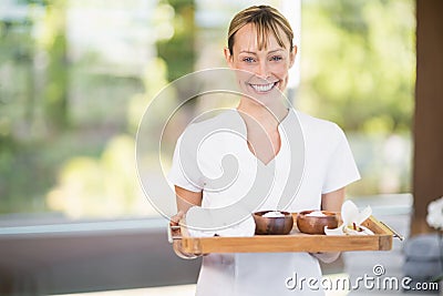 Female masseur with spa therapy products Stock Photo