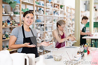 Female master potter invites you to pottery lessons Stock Photo