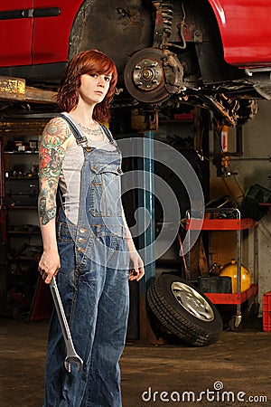 Female mechanic with tattoos Stock Photo