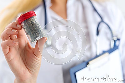 Female medicine doctor hand hold medical marijuana Stock Photo