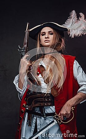 Female mercenary pirate with gun and sword Stock Photo