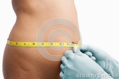 Female mid section being measure Stock Photo